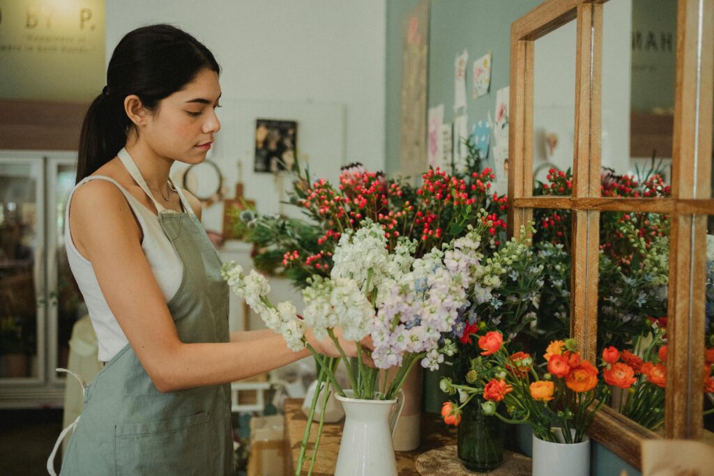 Young woman working in flower shop